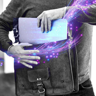 A person takes a laptop out of a laptop bag with binary code and other digital imagery 